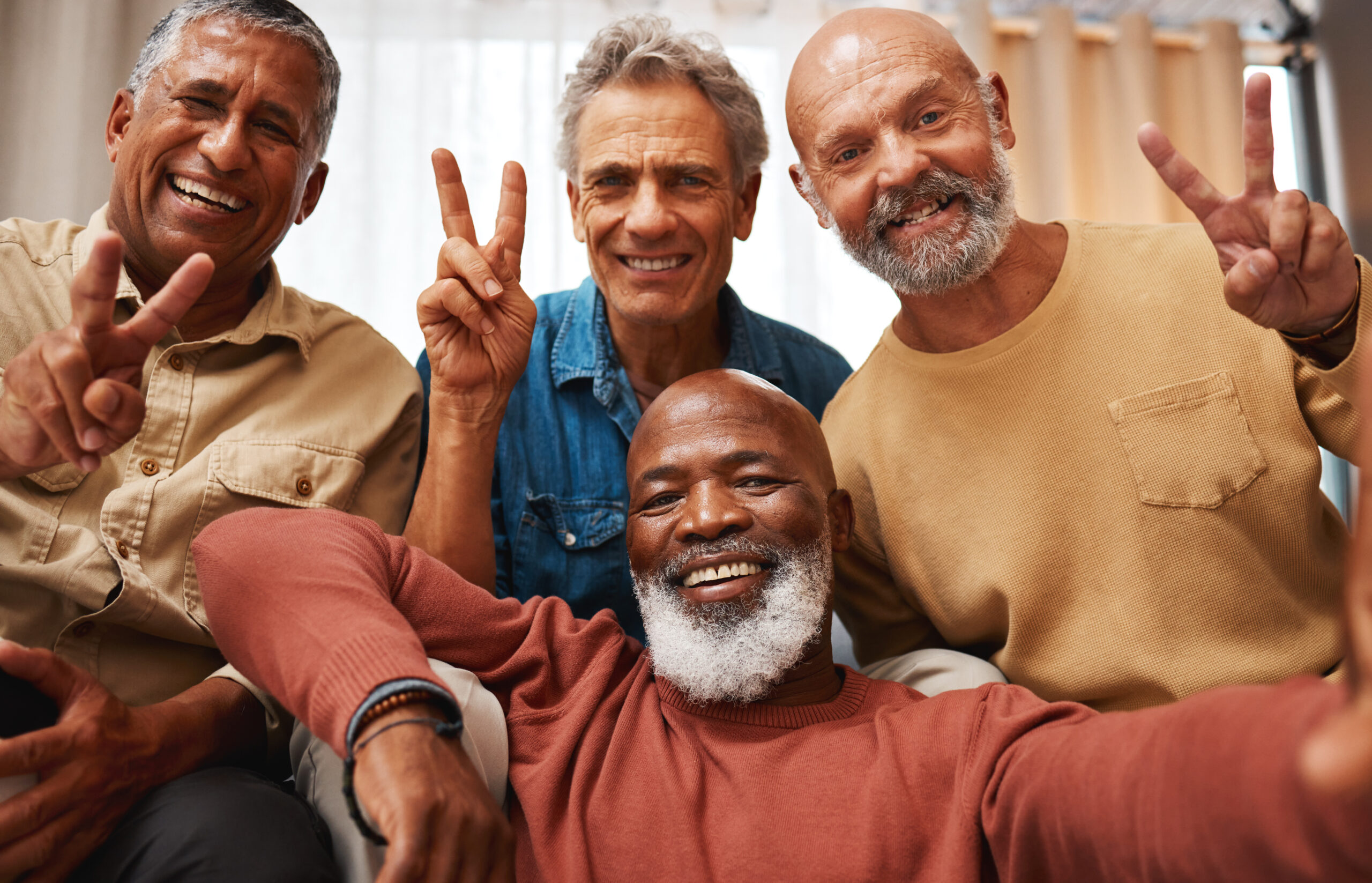 Peace, happy and portrait of men with a selfie, bonding and memory during retirement. Party, smile and elderly friends with a hand sign for happiness, quality time and photo at home together Peace, happy and portrait of men with a selfie, bonding and memory during retirement. Party, smile and elderly friends with a hand sign for happiness, quality time and photo at home together